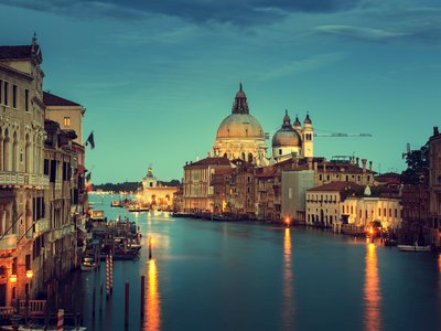 Grand Canal at night with artificial light reflecting off water, Venice, Italy