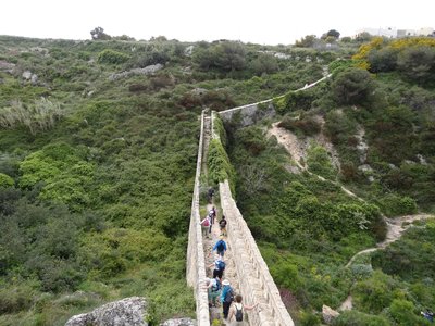 Group walking up to the Victoria Lines Ridge, historic defensive wall stretching across Malta, archipelago in the central Mediterranean between Sicily and North African coast